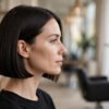 Woman with a classic chin-length blunt bob in a salon